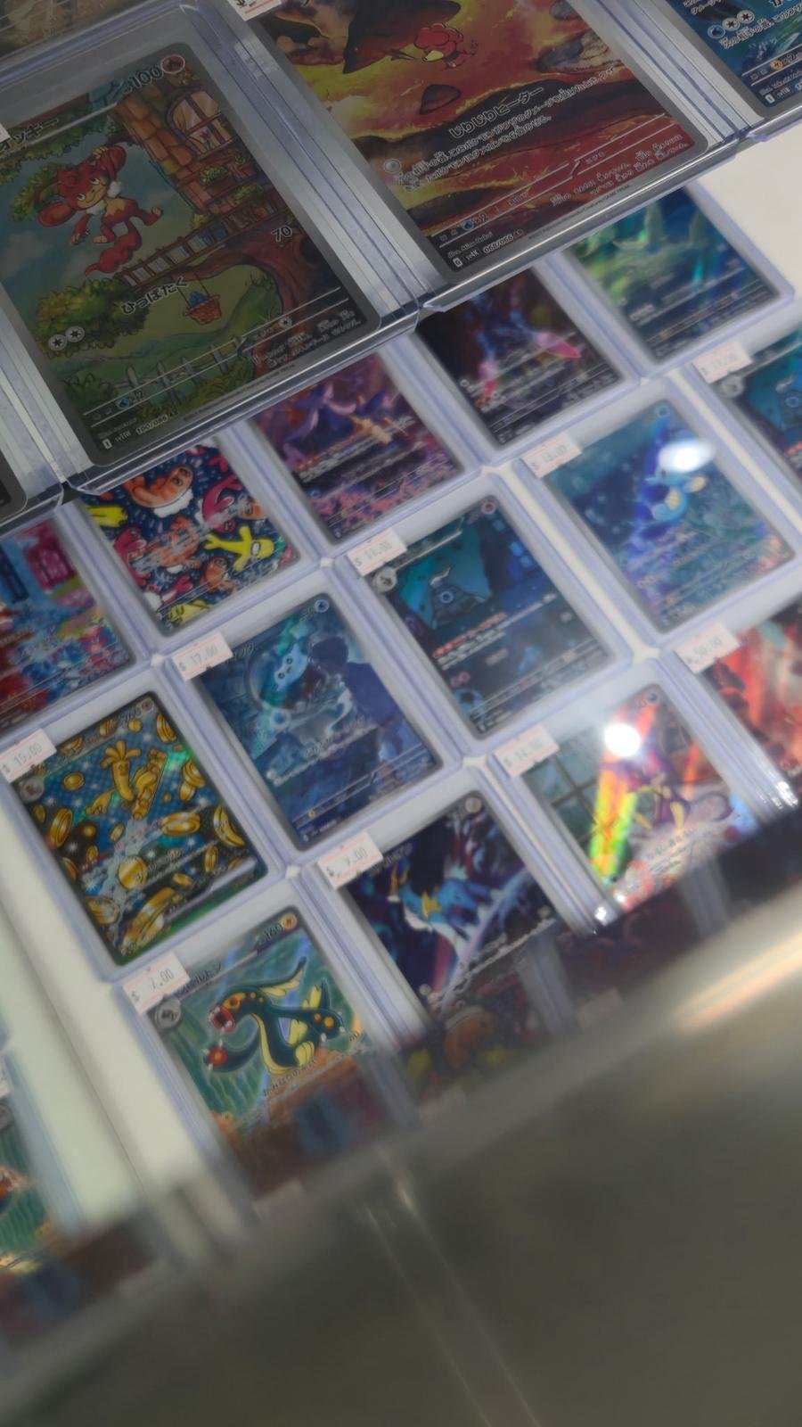 Pokémon cards in display case